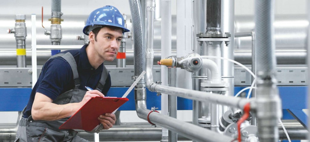 Industrial-trades-pipe-steam-fitting-category-man-looking-pipes Industrial-trades-pipe-steam-fitting-category-man-looking-pipes